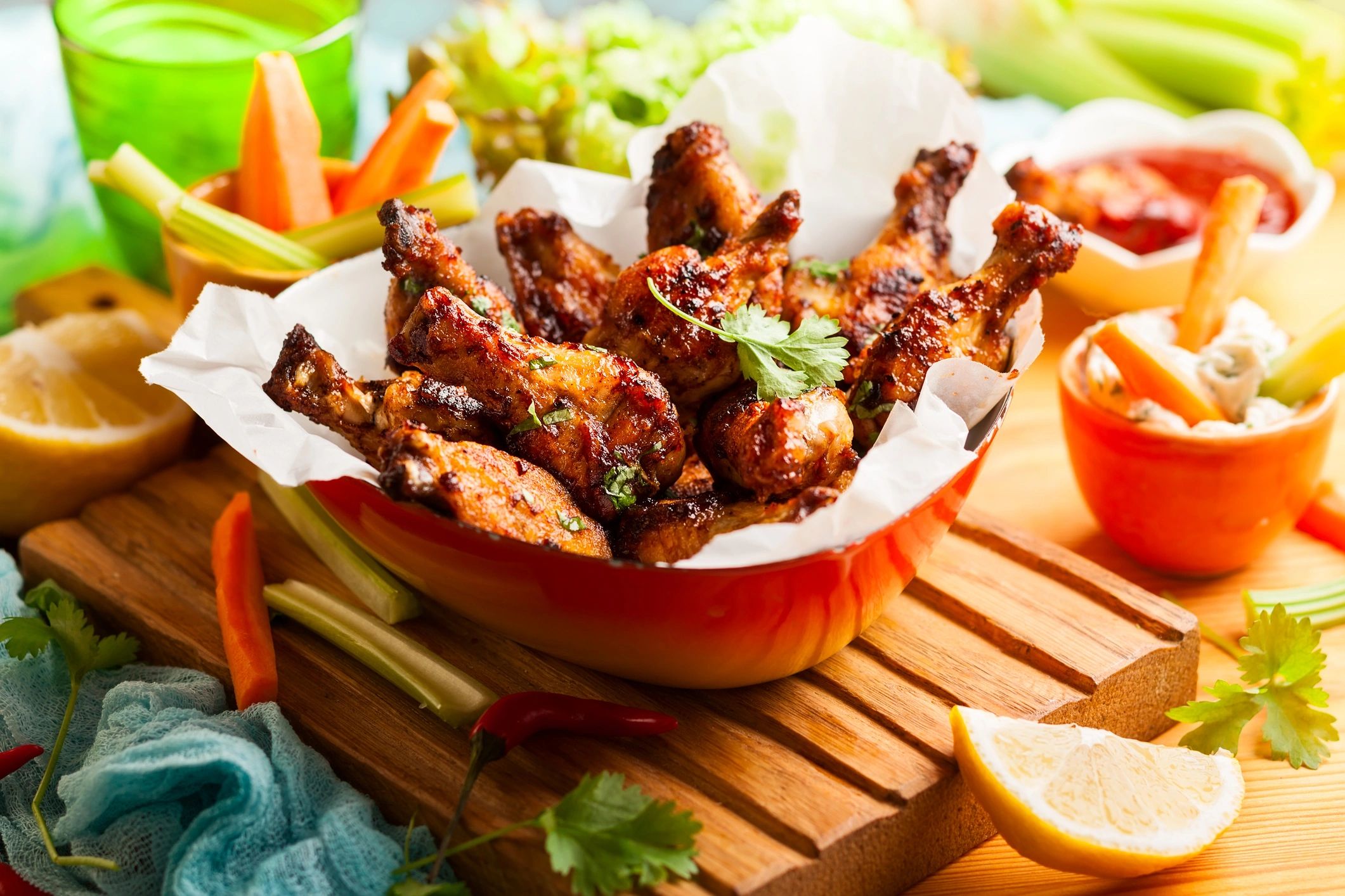 Barbecue chicken wings served with dipping sauces
