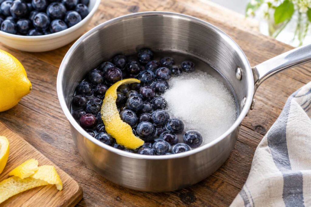 Blueberry Coffee Recipe: Easy Iced Blueberry Latte With Homemade Syrup 2 Blueberries sugar water and lemon peel in a saucepan for homemade blueberry coffee syrup
