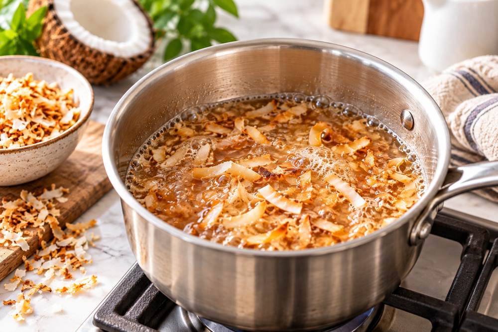 Coconut Syrup for Coffee: Easy Homemade Recipe 3 Simmering toasted coconut in sugar syrup for homemade coconut coffee syrup