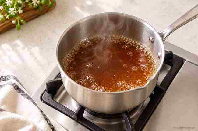 Brown Sugar Syrup for Coffee: Easy Homemade Recipe 4 Brown sugar syrup simmering in a saucepan on the stove