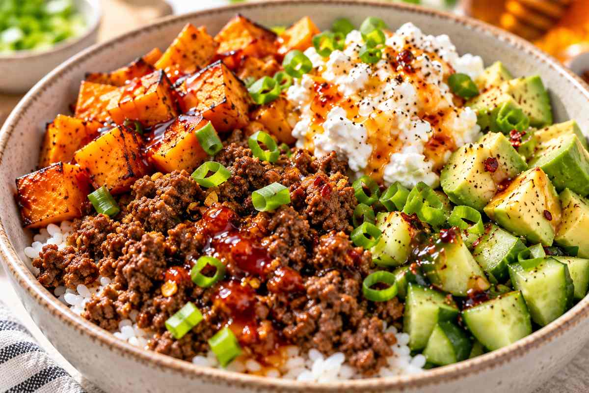 High Protein Hot Honey Ground Beef Bowls 7 Finished hot honey ground beef bowl with avocado and cucumber