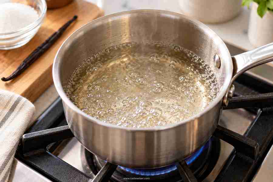 Vanilla Syrup for Coffee: Easy Homemade Recipe 4 Vanilla syrup base gently simmering in a saucepan on the stove