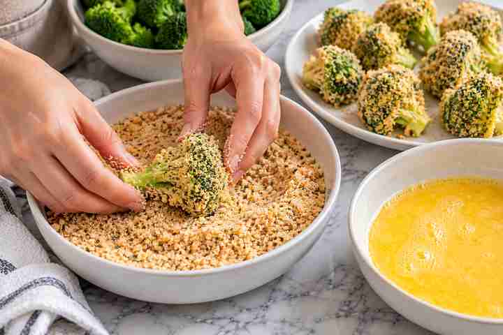 Breaded Broccoli Air Fryer Recipe (Golden & Crispy) 5 Broccoli florets dipped in egg and coated in panko Parmesan breadcrumbs