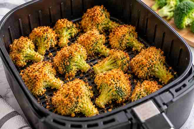 Breaded Broccoli Air Fryer Recipe (Golden & Crispy) 7 Golden crispy breaded broccoli florets cooked in air fryer basket