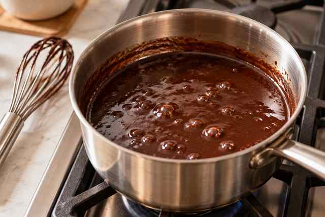 Mocha Syrup for Coffee: Easy Homemade Chocolate Coffee Syrup 5 Homemade mocha syrup gently simmering until glossy and slightly thickened