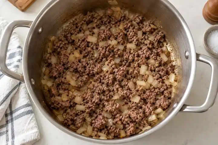 Easy One-Pot Lasagna Soup Recipe 2 One-Pot Lasagna Soup: Brown beef and soften onion